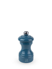 Peugeot | Bistro Pepper Mill, Pacific Blue: A blue lacquered Peugeot pepper grinder with metal adjustment knob, showcasing the iconic Peugeot lion logo at its base.