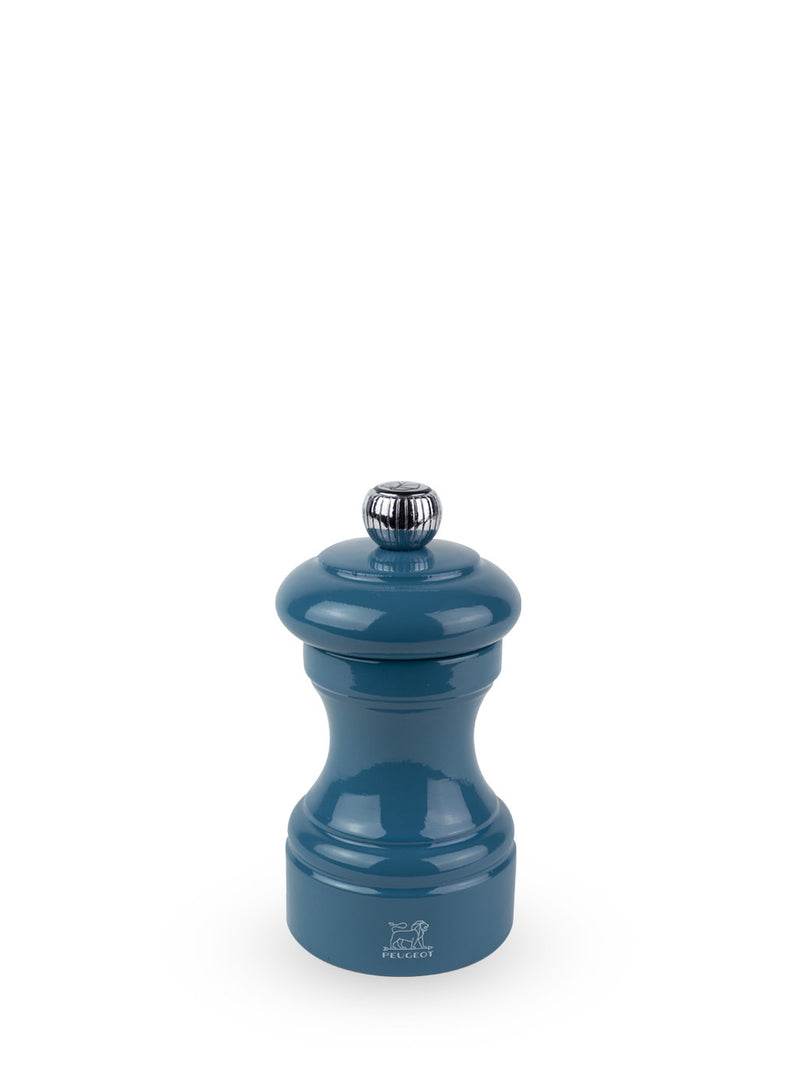 Peugeot | Bistro Pepper Mill, Pacific Blue: A blue lacquered Peugeot pepper grinder with metal adjustment knob, showcasing the iconic Peugeot lion logo at its base.
