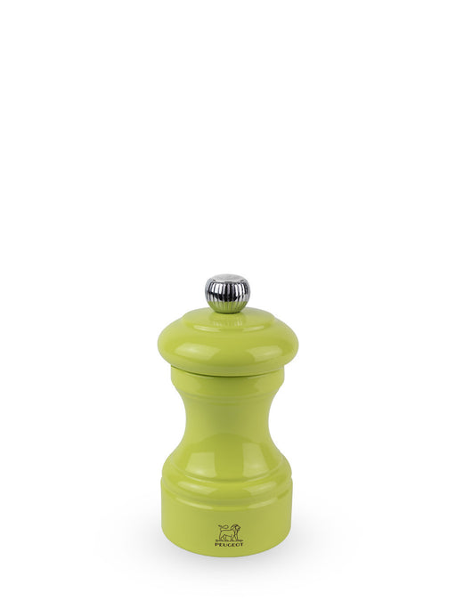 Peugeot | Bistro Salt Mill, Green Pistachio: A lime-green, glossy, classic-shaped grinder with a chrome knob, featuring the Peugeot lion logo near its base.
