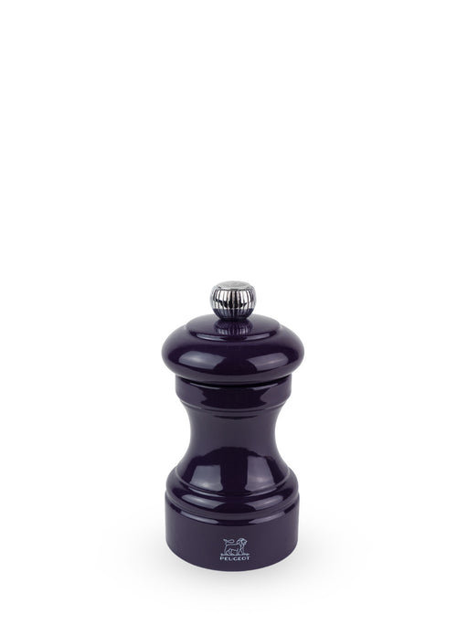 Peugeot | Bistro Salt Mill, Eggplant: A classic hourglass pepper grinder with a steel mechanism, featuring the Peugeot lion logo and a metal adjustment knob on top.