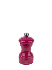 Peugeot | Bistro Salt Mill, Candy Pink: A glossy, hourglass-shaped salt mill with a metal knob for coarseness adjustment, featuring a durable steel mechanism.