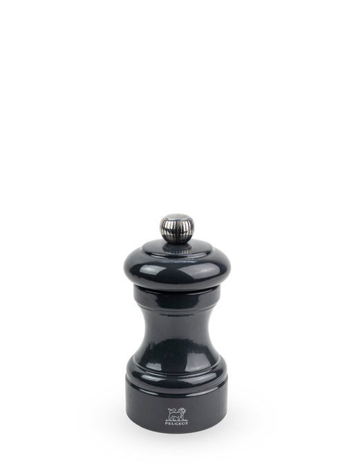 Peugeot | Bistro Salt Mill, Slate: Glossy-black pepper mill with Peugeot lion logo, adjustable top knob, and hourglass body, reflecting timeless elegance and high-performance design.