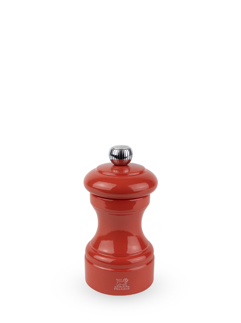 Peugeot | Bistro Salt Mill, Terracotta: Glossy red tabletop pepper grinder with chrome knob and Peugeot logo, offering adjustable grinding for fine or coarse salt crystals.
