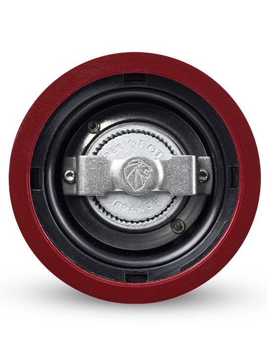 Close-up view of Peugeot Paris Chef u'Select Passion Red Salt Mill's grinding mechanism, showcasing the stamped metal grinder assembly for precise salt grinding.