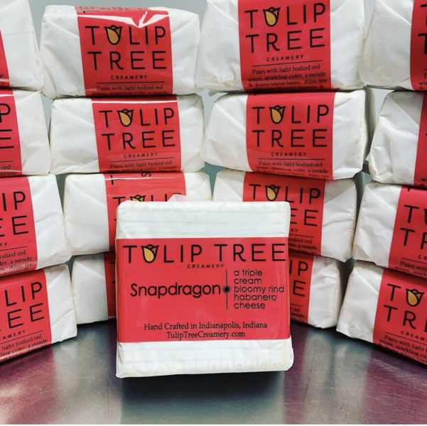 Tulip Tree Creamery - Snapdragon cheese blocks, individually wrapped, featuring a triple-cream, bloomy-rind with habanero peppers, crafted in Indianapolis, ideal for spicy food enthusiasts.
