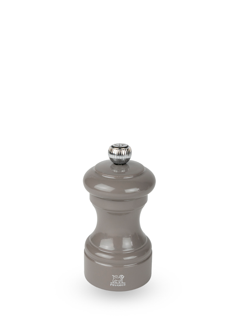 Peugeot | Bistro Pepper Mill, Smoked Grey: Glossy gray beechwood mill with a metal knob for grind adjustment and Peugeot lion logo, ideal for fresh peppercorn grinding.