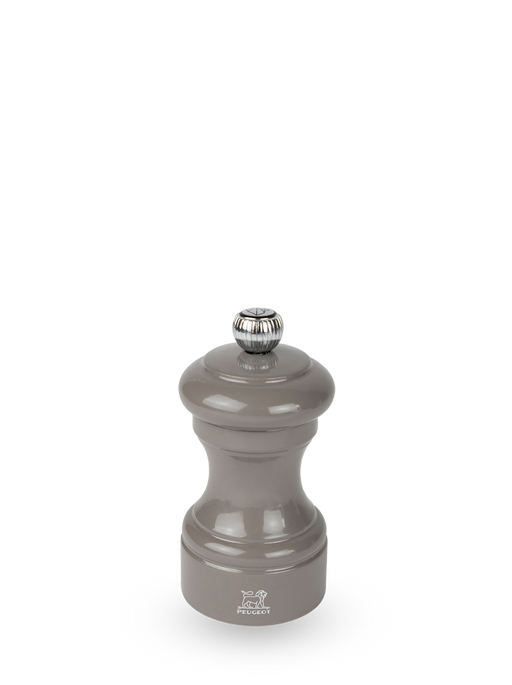 Peugeot | Bistro Pepper Mill, Smoked Grey: Glossy gray beechwood mill with a metal knob for grind adjustment and Peugeot lion logo, ideal for fresh peppercorn grinding.