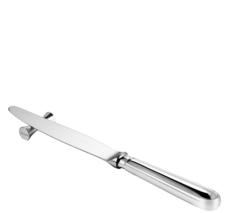 Christofle | Uni 2 Knife / Chopstick Rests, Silver Plated: A polished metal dinner knife rests on a matching metal knife-rest, ideal for elegant table settings.