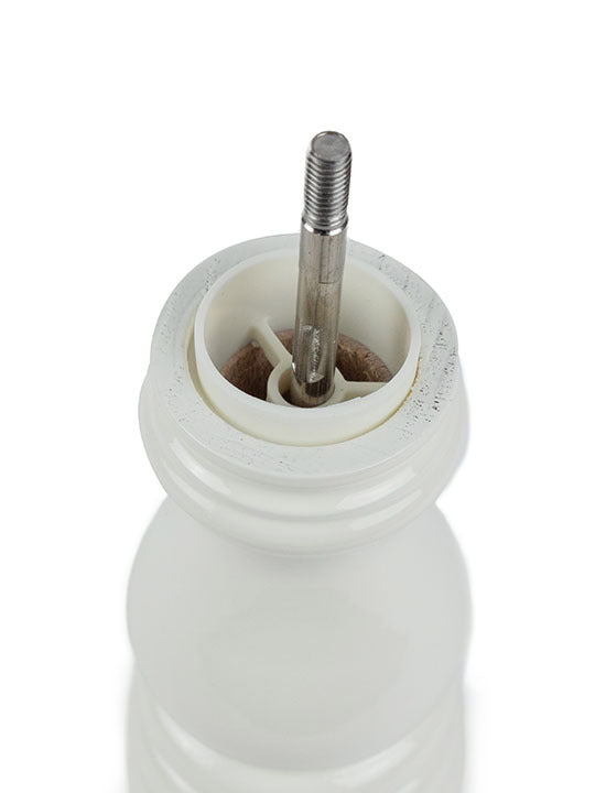 Inside view of Peugeot | Paris u'Select Ivory Lacquered Salt Mill, showing the central metal shaft and ceramic burr for precise salt grinding.