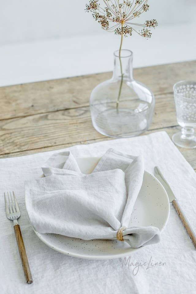 MagicLinen - Set of 2 linen napkins on a table, styled with a centerpiece, showcasing premium quality and timeless appeal for versatile table decor.
