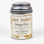 Oliver Pluff & Company - Orange Clove Hot Toddy Kit in a cylindrical metal tin, featuring spice bags for crafting hot toddy cocktails with cinnamon, orange peel, and cloves.