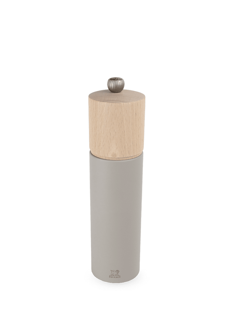 Peugeot Boreal Salt Mill with a matte-gray body and light-wood top, featuring an adjustable grind knob and Peugeot's lion logo at the base.