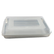 Nordic Ware | Naturals High Sided Sheetcake Pan with Lid, featuring a clear plastic cover for secure storage and transport of baked goods.
