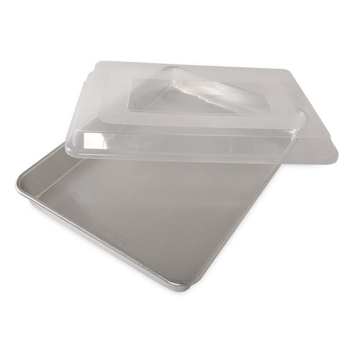 Nordic Ware | Naturals High Sided Sheetcake Pan with Lid, showcasing its sturdy aluminum design and practical cover for easy storage and transport.
