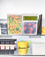 W&P - Freezer Cube Storage Containers: Set of 3 - Small/Medium/Large, displayed on a shelf, showcasing stackable, transparent containers ideal for efficient freezer storage.