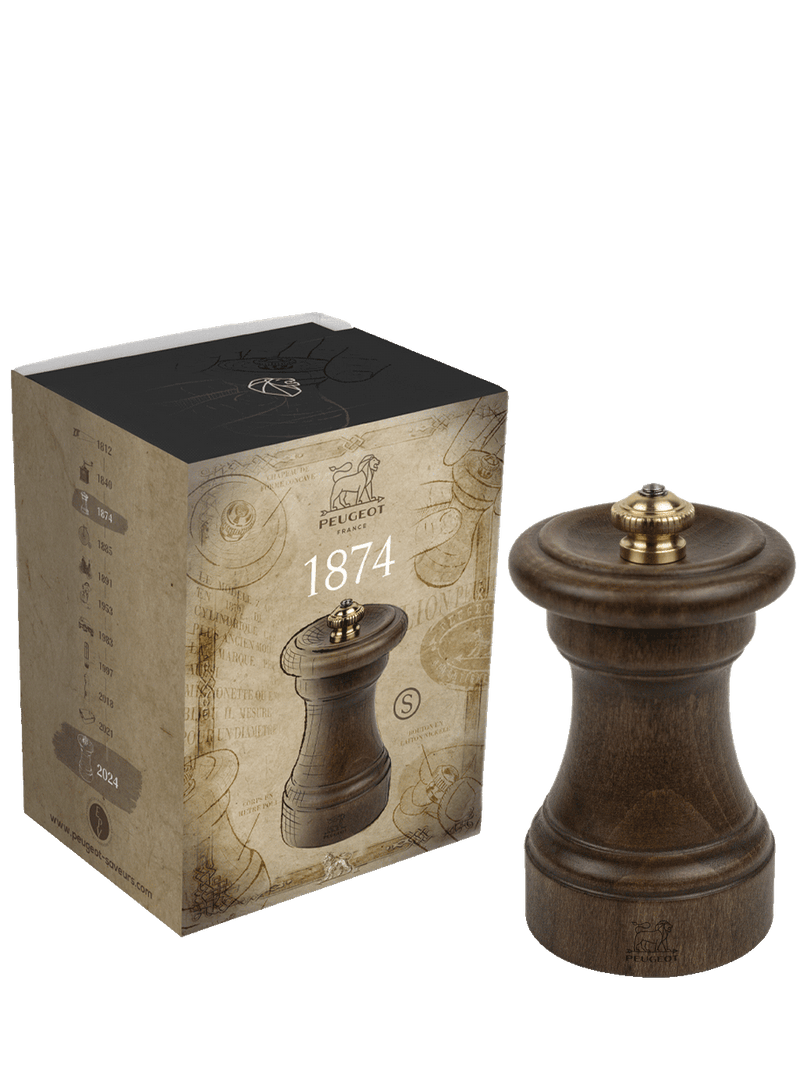 Peugeot | 1874 Manual Wooden Pepper Mill Antique Patina, 4 inches, features a stained wood design with a brass knob, highlighted by its heritage-inspired packaging.