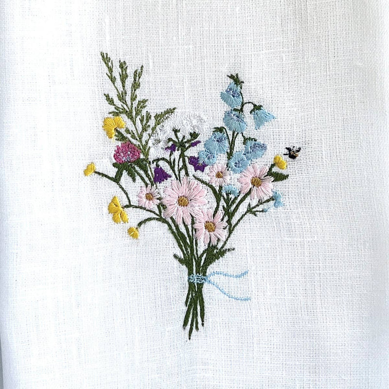 Arte Italica & Crown Linen Designs - Wildflower Bouquet Linen Towel: White (Multi) featuring embroidered wildflowers on white linen, enhancing kitchen decor with elegance.