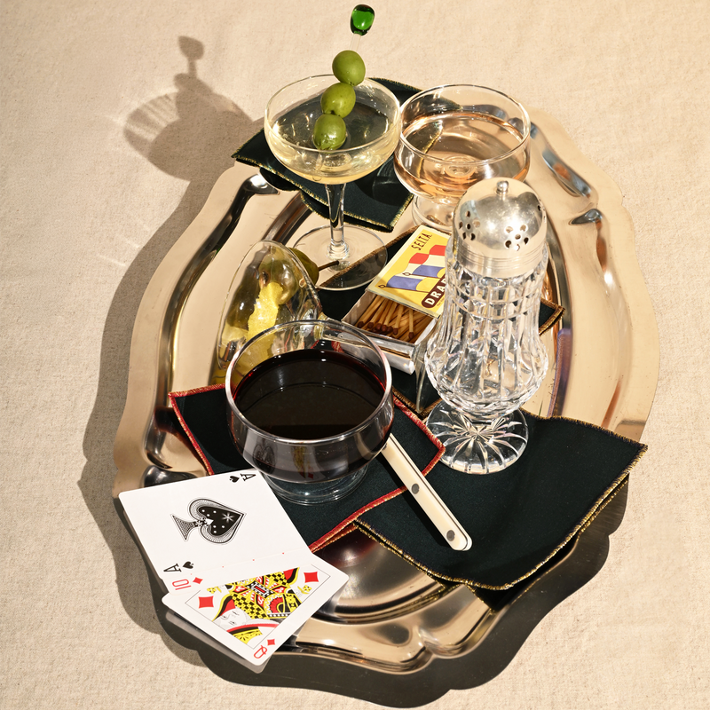 ATELIER SAUCIER - Tinsel Cocktail Napkins set on a silver tray, styled with cocktails, playing cards, and a knife, embodying festive cocktail sophistication.