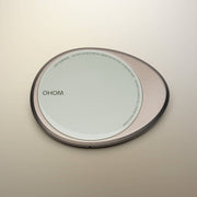 OHOM - Ui 3 Self-heating Mug Set: Jasmine White with a Qi-style wireless charging pad, featuring safety warnings on its rim.