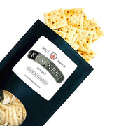 Krackers | Spicy Ranch: A bag of spicy ranch-flavored crackers, showcasing a close-up of a cracker and crackers on a plate, perfect for adventurous snackers.