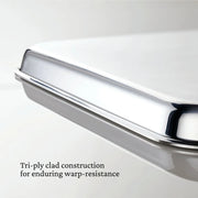 Hestan | OvenBond Tri-Ply Bakeware, Single Half Sheet Pan, shown with its warp-resistant tri-ply clad construction and wide handles for easy oven removal.
