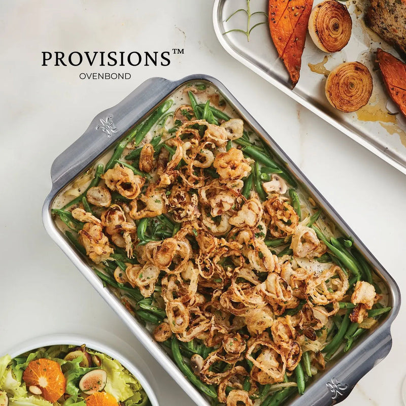 Hestan Oven Bond Tri-Ply Bakeware Quarter Sheet Pan featuring a green-bean casserole topped with crispy onions, showcasing its even heat distribution and sleek design.