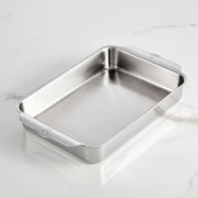 Hestan | Oven Bond Tri-Ply Bakeware, Rectangular Baker, shown empty on marble, with integrated handles and rounded corners, exemplifying durable craftsmanship for even baking and roasting.