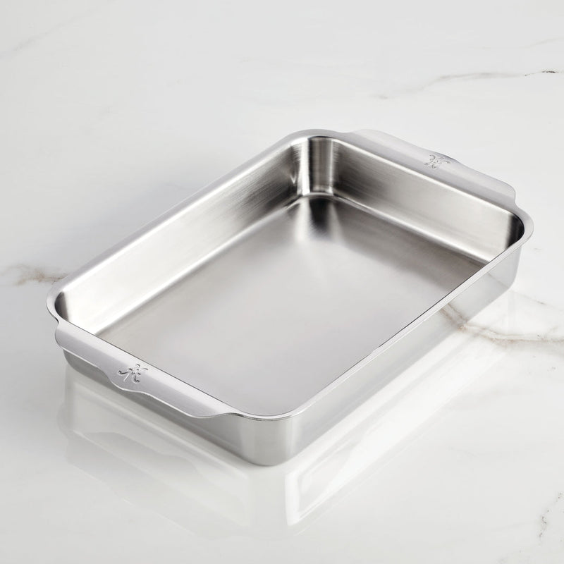 Hestan | Oven Bond Tri-Ply Bakeware, Rectangular Baker, shown empty on marble, with integrated handles and rounded corners, exemplifying durable craftsmanship for even baking and roasting.