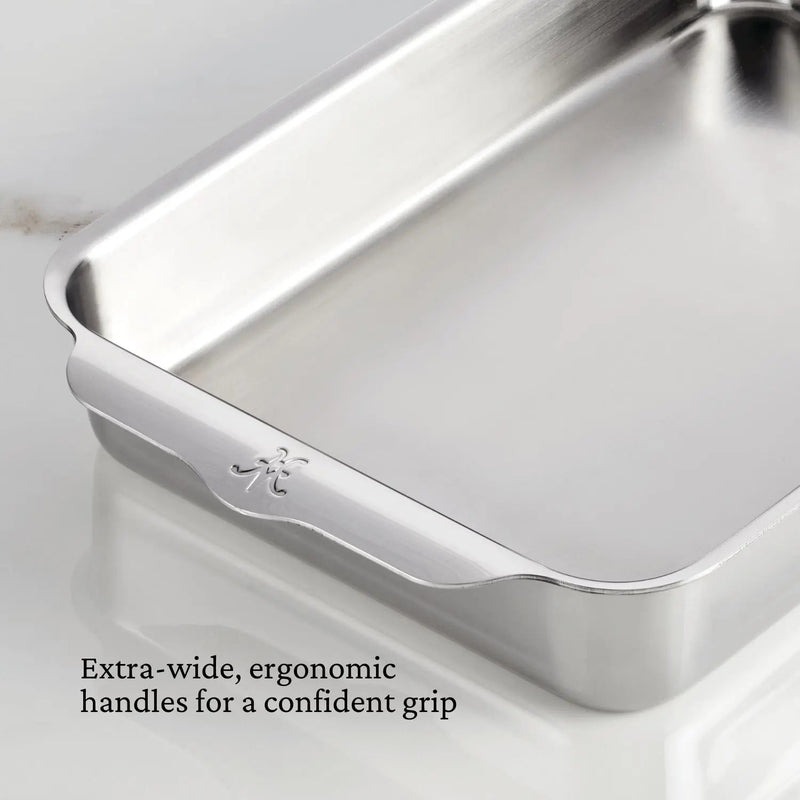 Hestan | Oven Bond Tri-Ply Bakeware, Rectangular Baker with extra-wide ergonomic handles for a confident grip, crafted from triple-bonded stainless steel, shown empty on a countertop.