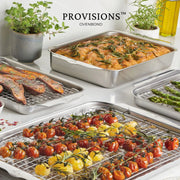 Provisions™ OvenBond bakeware in a kitchen scene with herb-topped focaccia, roasted tomatoes, sweet potatoes, and asparagus on wire racks, showcasing Hestan's five-piece stainless-steel set.
