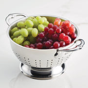Hestan Provisions | Stainless Steel Colanders, 5 Quart, filled with fresh green and red grapes, showcasing its capacity and drainage efficiency.