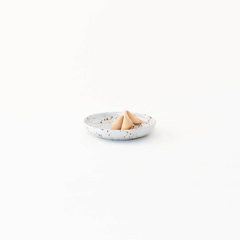 Sarah Kersten - Olive Dish: Basin Collection: Dove Grey, featuring a small, elegant dish holding a fortune cookie, ideal for versatile kitchen presentations.