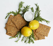 Norwegian Baked - Rosemary & Lemon Knekkebrød with lemons, rosemary, and sea salt, showcasing its artisanal quality and sophisticated flavor profile for Athens Cooks' culinary enthusiasts.