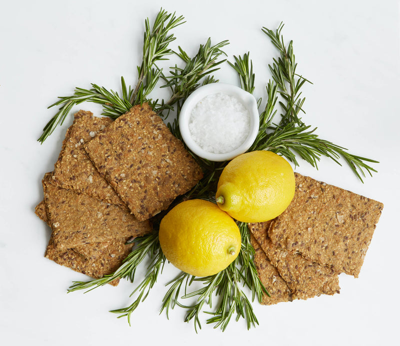 Norwegian Baked - Rosemary & Lemon Knekkebrød with lemons, rosemary, and sea salt, showcasing its artisanal quality and sophisticated flavor profile for Athens Cooks' culinary enthusiasts.