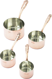 Coppermill Kitchen LLC - Coppermill Kitchen Vintage Inspired Measuring Cup set featuring four copper cups with decorative handles and tin lining, showcasing embossed vintage-inspired patterns.