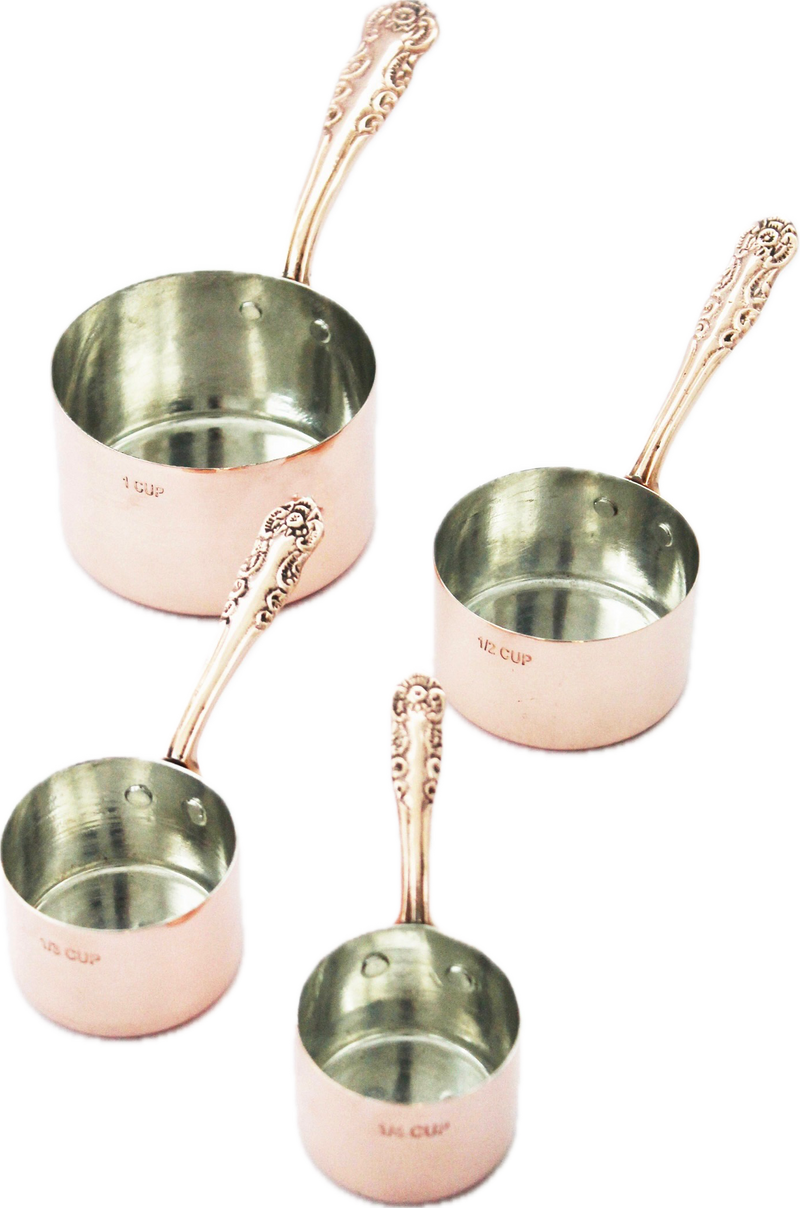 Coppermill Kitchen LLC - Coppermill Kitchen Vintage Inspired Measuring Cup set featuring four copper cups with decorative handles and tin lining, showcasing embossed vintage-inspired patterns.