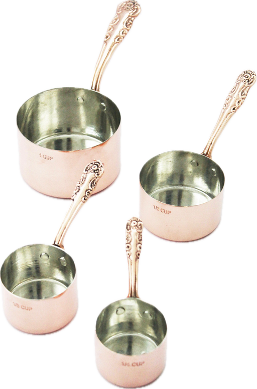 Coppermill Kitchen LLC - Coppermill Kitchen Vintage Inspired Measuring Cup set featuring four copper cups with decorative handles and tin lining, showcasing embossed vintage-inspired patterns.