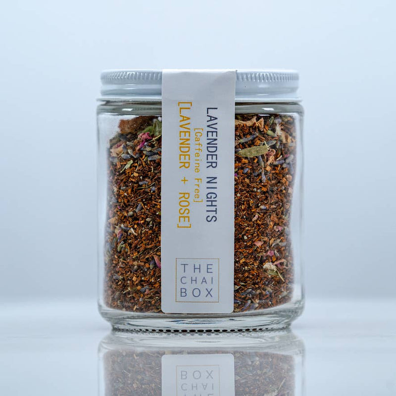 The Chai Box | Lavender Nights - Caffeine Free Rooibos Lavender Tea - 6.0oz pouch, featuring jars of dried herbs and a close-up of the packaging.