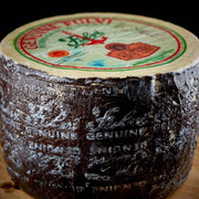 Nicola's Marketplace - Genuine Fulvi® Pecorino Romano DOP: 7 Ounces cheese wheel with black wax coating and branded anchor logo label on top.