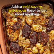 Diaspora Co. Spices - Steak Masala blend with spices displayed on a tray, featuring pieces of seasoned meat, emphasizing its flavorful ingredients for versatile cooking.