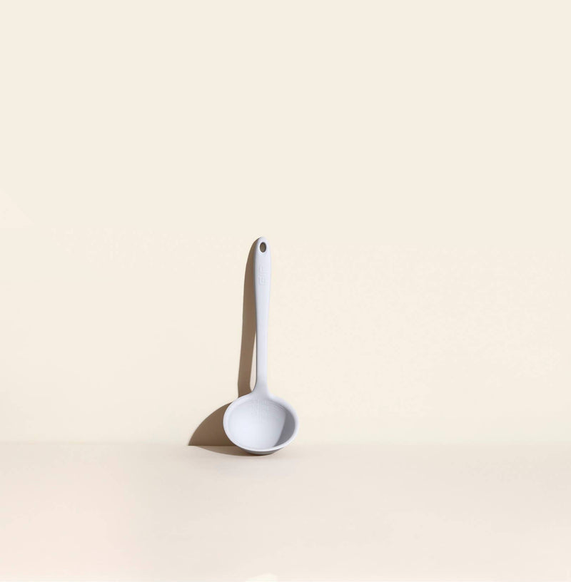 GIR Get It Right - GIR Ultimate Ladle: Studio, showcasing a precision pouring edge, deep scoop with embossed measurements, and ergonomic handle on a white surface.