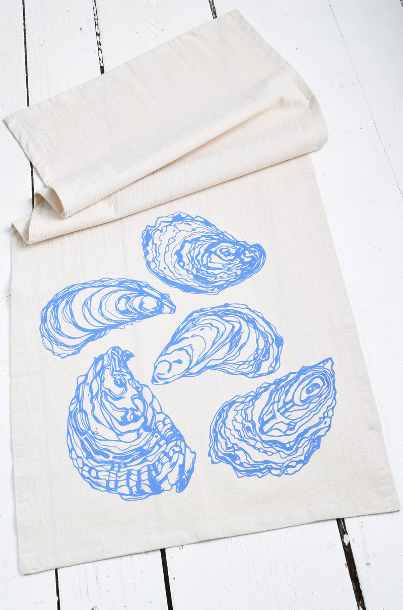 Hearth and Harrow - Oyster Tea Towel in Blue-violet, featuring an intricate blue oyster design on organic cotton, perfect for enhancing any kitchen decor.