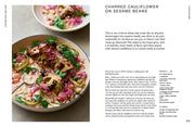 Cookbook spread for 'Cooking Fast And Slow' by Penguin Random House LLC, featuring a charred cauliflower and sesame beans recipe with ingredients and cooking instructions.