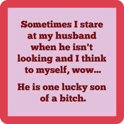 Drinks on Me - COASTER Lucky Son Of A Bitch; a humorous, 4”x4” resin coaster with cork backing, perfect for adding charm to bar decor.