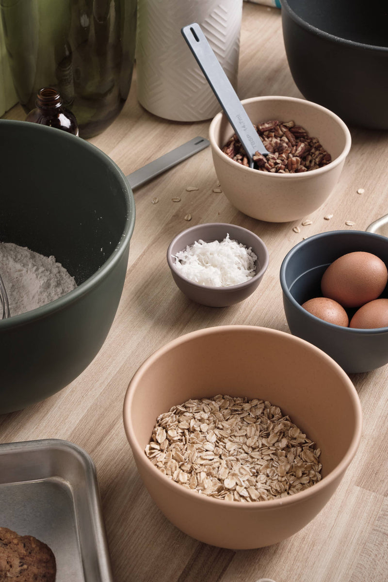 Bamboozle - 5-Piece Astrik Mixing Bowl Set: Fresh Guacamole displayed on a table with various ingredients, showcasing its eco-friendly, versatile design ideal for baking and cooking.