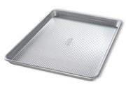 USA Pan | Sheet Pans - Half Sheet Pan, ideal for toaster ovens, features a ridged surface and Americoat® nonstick for easy release and cleanup.
