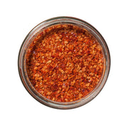 San Juan Island Sea Salt - Kimchi Seasoning Blend in a glass jar, featuring crushed red chili-pepper flakes with gochugaru, garlic, and ginger for tangy, mildly spicy flavor.