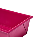 Great Jones | Breadwinner - Raspberry loaf pan with a wavy, corrugated bottom, designed for easy release and scratch resistance.