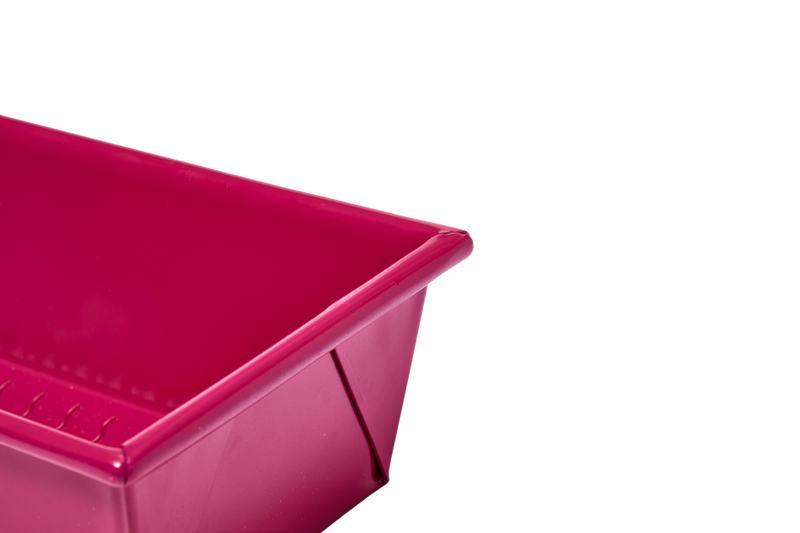 Great Jones | Breadwinner - Raspberry loaf pan with a wavy, corrugated bottom, designed for easy release and scratch resistance.