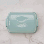 Nordic Ware | Cakes and Cupcakes Carrier featuring a clear domed lid, scalloped edging, and snap-up locking handles, ideal for transporting cakes and cupcakes.